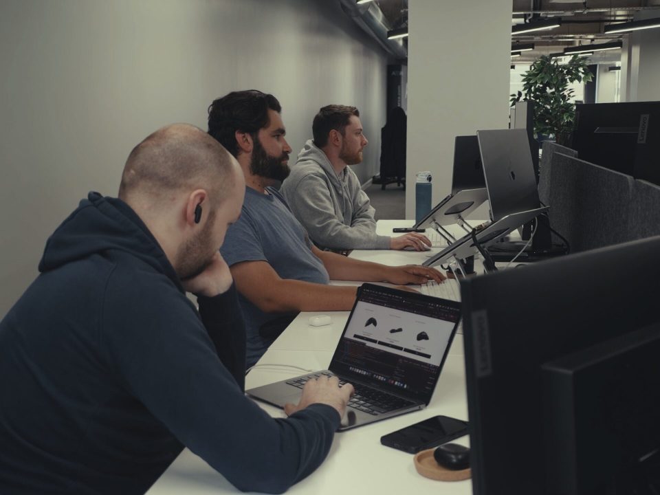 Members of the Techquity development team working in the studio
